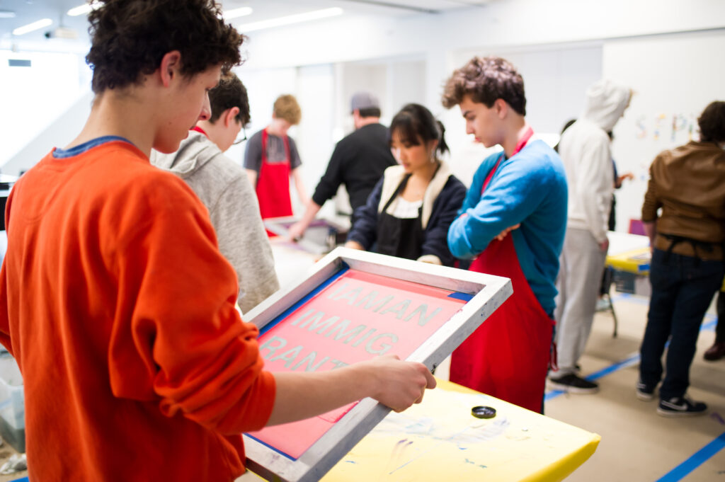 Student looking at a print